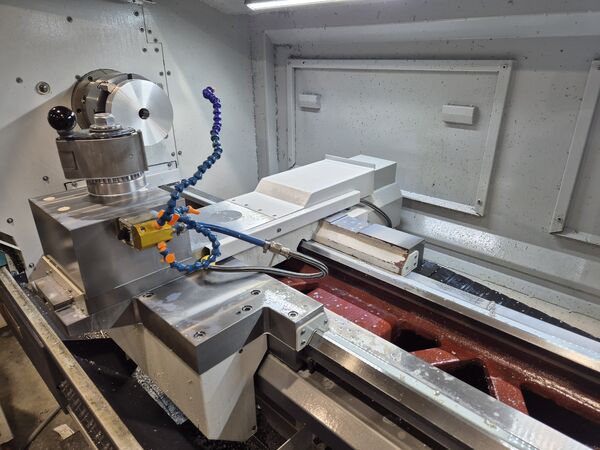 Turning a metal part on a CNC lathe — MIKRO-PRO workshop, Ruše.