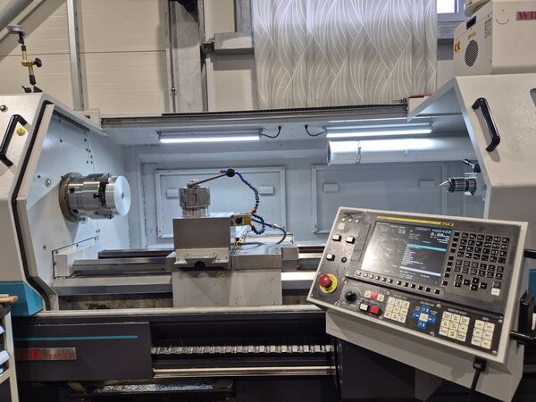 Turning a metal part on a CNC lathe — MIKRO-PRO workshop, Ruše.